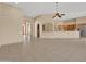 Open living area features tile flooring and seamlessly connects to the kitchen, creating a cohesive space at 8031 W Morten Ave, Glendale, AZ 85303