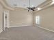 Inviting living room with tray ceilings and neutral carpet at 8031 W Morten Ave, Glendale, AZ 85303