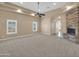 Spacious living room with stone fireplace and natural light at 8031 W Morten Ave, Glendale, AZ 85303