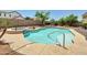 Backyard features a beautiful in-ground pool and a hot tub for relaxing at 8031 W Morten Ave, Glendale, AZ 85303