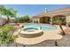 Backyard featuring an in-ground pool, hot tub, and landscaped surroundings at 8031 W Morten Ave, Glendale, AZ 85303