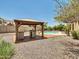 Pool and outdoor kitchen in backyard at 8031 W Morten Ave, Glendale, AZ 85303