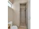 Bathroom features a shower with glass door and tiled walls at 8031 W Morten Ave, Glendale, AZ 85303
