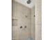 Spa-like shower showcasing multiple shower heads, a built-in niche, and neutral ceramic tiling at 8031 W Morten Ave, Glendale, AZ 85303