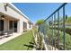 Fenced backyard with artificial turf, neutral patio, outdoor seating and partial covered patio at 8180 E Shea Blvd # 1019, Scottsdale, AZ 85260