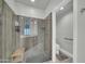 Modern bathroom with a glass shower, tiled walls, and a convenient built-in bench at 8180 E Shea Blvd # 1019, Scottsdale, AZ 85260