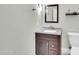 Bathroom with granite counters, dark wood vanity, and updated fixtures at 8180 E Shea Blvd # 1019, Scottsdale, AZ 85260