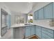 Beautiful kitchen featuring stainless steel appliances, light blue cabinets, and a convenient kitchen island at 8180 E Shea Blvd # 1019, Scottsdale, AZ 85260