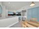Bright kitchen with a center island, stainless steel appliances, and light blue cabinetry at 8180 E Shea Blvd # 1019, Scottsdale, AZ 85260