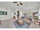 Bright living area with tile floors, comfortable seating, fireplace, and a ceiling fan at 8180 E Shea Blvd # 1019, Scottsdale, AZ 85260