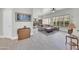 Open-concept living area boasts tile flooring, plantation shutters, and stylish décor for comfortable living at 8180 E Shea Blvd # 1019, Scottsdale, AZ 85260