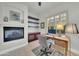 Cozy office with a fireplace and built-in shelving at 8180 E Shea Blvd # 1019, Scottsdale, AZ 85260