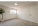Bright bedroom featuring carpet flooring and natural lighting from a window at 909 S Acapulco Ln # A, Tempe, AZ 85281