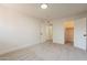 Spacious bedroom with carpet flooring and a connected closet at 909 S Acapulco Ln # A, Tempe, AZ 85281