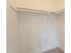 Spacious walk-in closet with shelving, offering ample storage space at 909 S Acapulco Ln # A, Tempe, AZ 85281