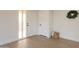 Bright entryway with new flooring and a white front door, creating an inviting first impression at 909 S Acapulco Ln # A, Tempe, AZ 85281