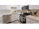 Modern kitchen featuring stainless steel appliances, stylish countertops, and ample storage at 909 S Acapulco Ln # A, Tempe, AZ 85281