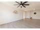 A spacious living area with a ceiling fan, and an open layout, perfect for entertaining and relaxation at 909 S Acapulco Ln # A, Tempe, AZ 85281