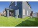 Large backyard features artificial turf, golf putting area, and play area, perfect for outdoor fun at 9352 E Saturn Ave, Mesa, AZ 85212