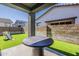 Inviting covered patio with artificial grass, block wall and outdoor play area at 9352 E Saturn Ave, Mesa, AZ 85212