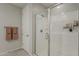 Contemporary bathroom featuring a glass-enclosed shower and neutral-colored fixtures at 9352 E Saturn Ave, Mesa, AZ 85212
