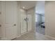 Modern bathroom with a glass-enclosed shower and views into the bedroom at 9352 E Saturn Ave, Mesa, AZ 85212