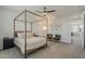 Comfortable bedroom with a four-poster bed, plush seating, and modern design at 9352 E Saturn Ave, Mesa, AZ 85212