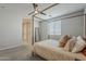 Serene bedroom with a four-poster bed, soft colors, and ample natural light at 9352 E Saturn Ave, Mesa, AZ 85212