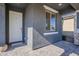 Welcoming front porch featuring a stylish front door, a window, and neutral color scheme at 9352 E Saturn Ave, Mesa, AZ 85212