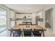 Bright kitchen and dining area with stainless appliances, white cabinetry, and natural light that floods the room at 9352 E Saturn Ave, Mesa, AZ 85212