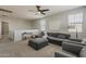 Open living room featuring a large sectional, two armchairs, and plenty of natural light at 9352 E Saturn Ave, Mesa, AZ 85212