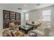 Inviting living room with comfortable seating, built-in shelving, and plenty of natural light at 9352 E Saturn Ave, Mesa, AZ 85212