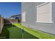 This backyard is equipped with a putting green made of artificial grass at 9352 E Saturn Ave, Mesa, AZ 85212