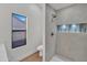 Stylish bathroom featuring a tiled shower, modern toilet, and bright natural light at 1001 N Nielson St, Gilbert, AZ 85234
