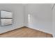 Simple and bright bedroom with laminate flooring and a window offering natural light at 1001 N Nielson St, Gilbert, AZ 85234