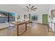 Stylish dining area with clear chairs, light floors and a sleek table for elegant meals at 1001 N Nielson St, Gilbert, AZ 85234