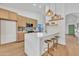 Modern kitchen featuring a quartz countertop, updated cabinets, and stainless steel appliances at 1001 N Nielson St, Gilbert, AZ 85234