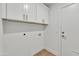 Clean, functional laundry room with white cabinets and modern connections at 1001 N Nielson St, Gilbert, AZ 85234
