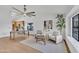 Bright and airy living room featuring modern furnishings, a ceiling fan, and ample natural light at 1001 N Nielson St, Gilbert, AZ 85234