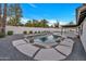 Refreshing backyard pool, surrounded by lush landscaping, offers a private oasis for relaxation and fun at 1001 N Nielson St, Gilbert, AZ 85234