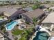 Beautiful aerial view of a backyard with a sparkling pool, a patio dining set, and desert landscaping at 10333 E Gold Nugget Ct, Gold Canyon, AZ 85118