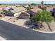 Bird's eye view of a charming home with desert landscaping, a two-car garage, and a well-manicured yard at 10333 E Gold Nugget Ct, Gold Canyon, AZ 85118