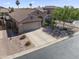High-angle view of a beautiful home featuring desert landscaping, two-car garage, and a well-kept exterior at 10333 E Gold Nugget Ct, Gold Canyon, AZ 85118