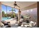 Inviting back patio with comfortable seating, ceiling fan, and a view of the pool at 10333 E Gold Nugget Ct, Gold Canyon, AZ 85118