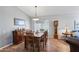 Well-lit dining room boasts a decorative sideboard and stylish chandelier at 10333 E Gold Nugget Ct, Gold Canyon, AZ 85118