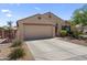 Attractive home with a two-car garage, drought resistant landscaping and a well-maintained front yard at 10333 E Gold Nugget Ct, Gold Canyon, AZ 85118