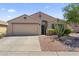 Charming single-story home featuring a two-car garage and desert landscaping for low maintenance living at 10333 E Gold Nugget Ct, Gold Canyon, AZ 85118
