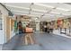 Spacious garage with ample storage, work area, and well-organized shelving units at 10333 E Gold Nugget Ct, Gold Canyon, AZ 85118