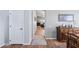 Hallway view with wood flooring and decor leading toward the living room at 10333 E Gold Nugget Ct, Gold Canyon, AZ 85118
