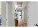 Long hallway featuring wood floors and an elegant console table at 10333 E Gold Nugget Ct, Gold Canyon, AZ 85118